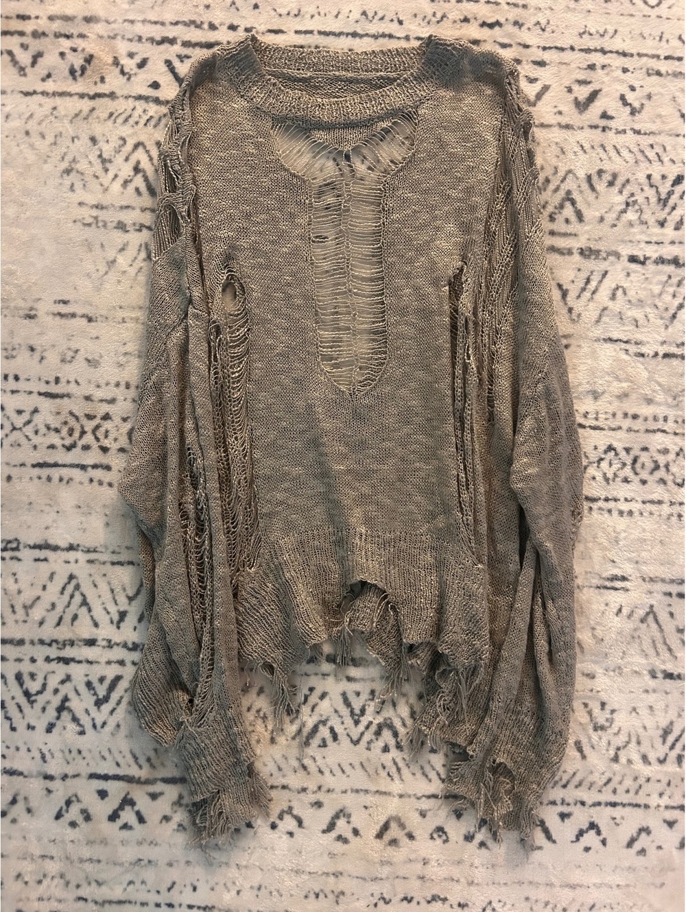 Distressed Gray Knit Sweater with Large Holes and Frayed Edges
